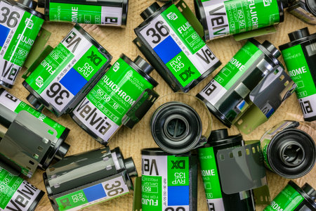Fort Collins, CO, USA - July 18, 2020: Rolls of 35mm Fujichrome Velvia fim, random background of film canisters. This very saturated color slide film used to be popular among nature and landscape photographers.のeditorial素材