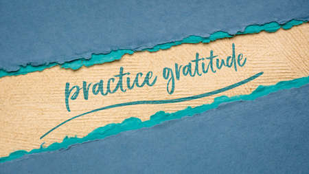 practice gratitude inspirational note - handwriting on a handmade paper, web banner