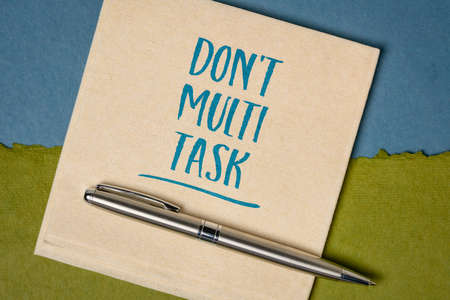 do not multitask -  efficiency advice or reminder - handwriting on a napkin, business and personal...