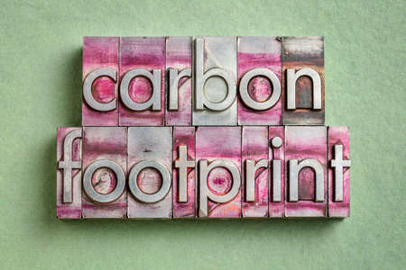 carbon footprint word abstract in gritty vintage letterpress metal types, environmental conceptの写真素材