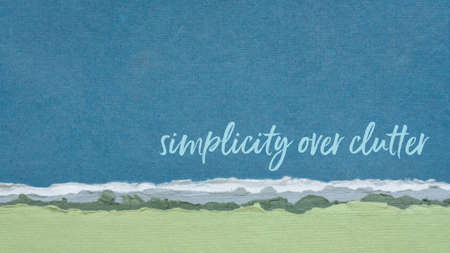 simplicity over clutter inspirational concept - handwriting on handmade paper, decluttering and...