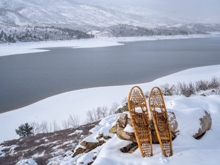 winter scenery of Horsetooth Reservoir in northern Colorado with classic Bear Paw snowshoesの写真素材