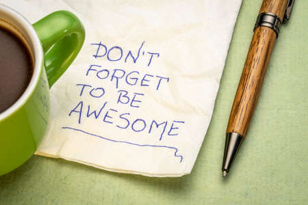 do not forget to be awesome - inspirational handwriting on a napkin with a cup of coffee, positivity and personal development conceptの写真素材