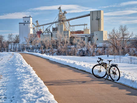 touring bike on a bike trail along the Poudre RIver in Fort Collins, Colorado, winter scenery. recreation and commuting conceptの写真素材