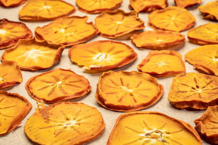 slices of dried persimmon fruit slices - fruit snackの写真素材