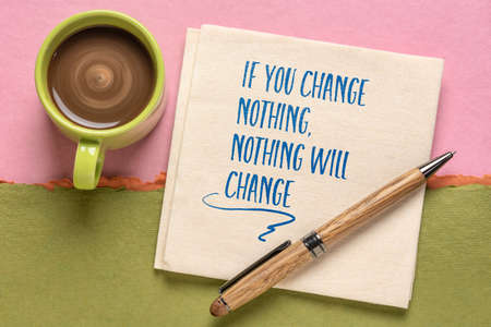 if you change nothing, nothing will change inspirational note, handwriting on a napkin with a cup of...