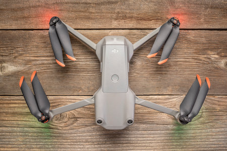 Fort Collins, CO, USA - July 4, 2021: DJI Mavic Air 2s on a wooden deck, a small advanced prosumer folding drone ready for take off.のeditorial素材