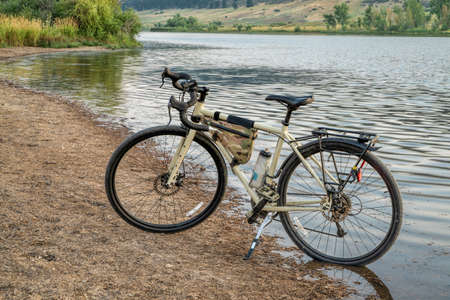 touring or gravel bicycle on lake shore at Colorado foothills, summer sceneryの写真素材