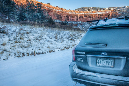 Fort Collins, CO, USA - December 24, 2009: Winter driving in Colorado, Subaru Outback car on a backcountry road covered by snow and frost.のeditorial素材