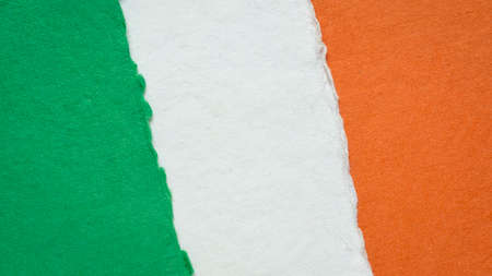 paper abstract in colors of national flag of Ireland (green, white and orange), collection of handmade rag paper sheetsの写真素材