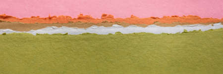 abstract landscape in green, orange and pink pastel tones - a collection of handmade rag papers, panoramic web bannerの写真素材