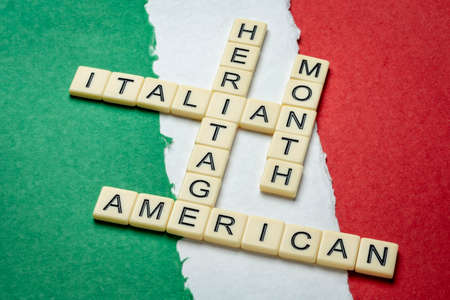October - National Italian American Heritage Month, crossword against paper abstract in colors of national flag of Italy (green, white and red), reminder of cultural eventの写真素材