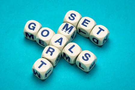 set SMART goals - crossword in letter cubes against textured paper, goal setting, business and personal development conceptの写真素材