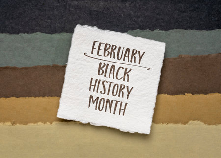 February -  Black (African-American) History Month, handwriting against abstract paper landscape in earth tones, annual observance originating in the United Statesの写真素材