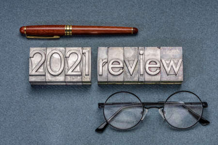 2021 review banner - annual review or summary of the recent year - word abstract in grunge letterpress metal type blocks, business and financial conceptの写真素材