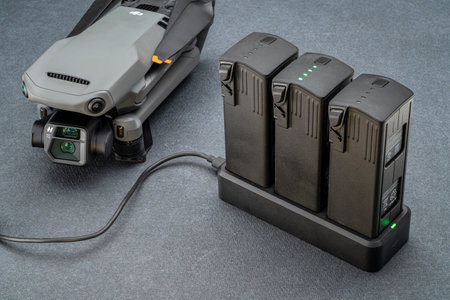 Fort Collins, CO, USA - December 20, 2021: Charging batteries for Mavic 3, DJI foldable consumer drone with enhanced flight time.のeditorial素材
