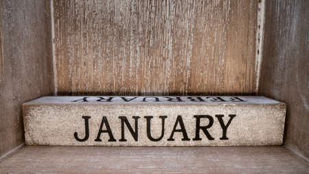 January text on grunge wooden block inside box, calendar and New Year conceptの写真素材