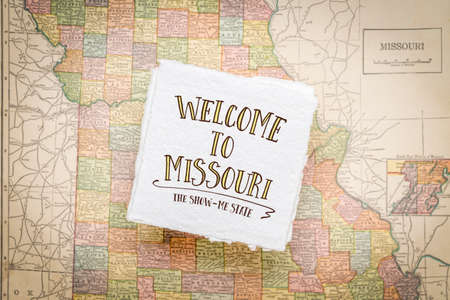 welcome to Missouri, the show-me state - handwriting on a square sheet of rough handmade paper floating over vintage defocused map of Missouriの写真素材