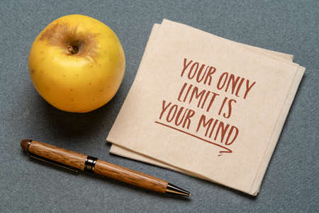 Your only limit is your mind - inspirational handwriting on a napkin with apple, personal development, growth and coaching conceptの写真素材