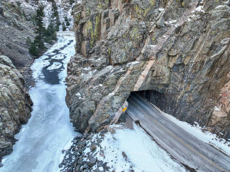 highway tunnel and river canyon  in Rocky Mountains of Colorado - Poudre River at Little Narrows in winter scenery, aerial perspectiveの写真素材