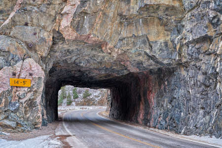 mountain road with a tunnel - Poudre River Canyon in northern Coloradoの写真素材