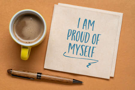 I am proud of myself handwriting on a napkin with coffee, accomplishment, success, positive affirmation and personal development conceptの写真素材