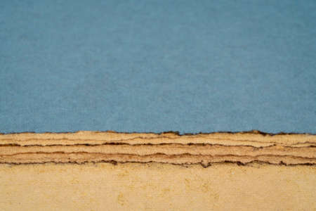 abstract desert landscape  created with sheets of textured colorful handmade paper
