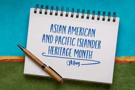 Asian American and Pacific Islander Heritage Month, May - handwriting in a sketchbook against abstract landscape, reminder of cultural eventの写真素材
