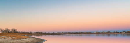 dusk over lake in Colorado, Boyd Lake State Park panoramaの写真素材