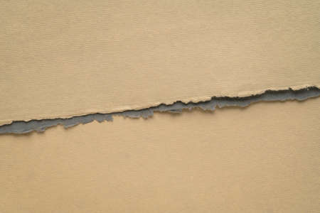 divided paper background in earth tones with a copy spaceの写真素材