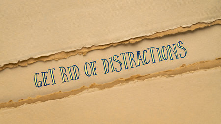 get rid of distractions motivational banner, text on handmade paper in earth tone, productivity conceptの写真素材