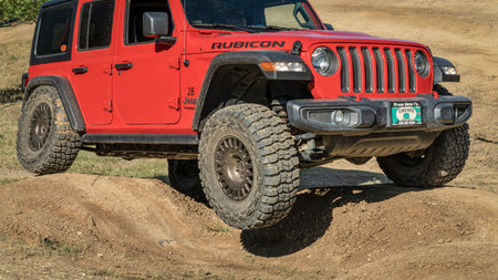 Loveland, CO, USA - August 27, 2022: Jeep Wrangler, Rubicon model,  on a dusty training drive off-road course.のeditorial素材