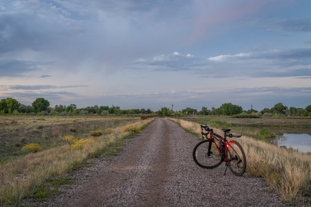 gravel bike with head and tail lights on a dirt road in Colorado countrysideの写真素材