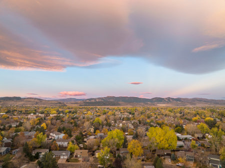 October dawn over Fort Collins and foothills of Rocky Mountains in northern Colorado, aerial viewの写真素材