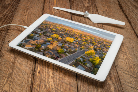 October dawn over Fort Collins and foothills of Rocky Mountains in northern Colorado, aerial view on a digital tabletの写真素材
