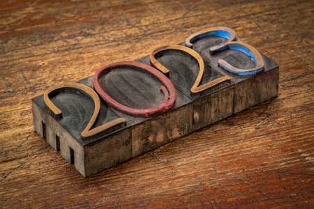 2023 number abstract in vintage  ornamental letterpress wood type against rustic, weathered wood, New Year greeting card or bannerの写真素材