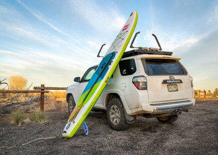 Fort Collins, CO, USA - February 17, 2023: Toyota 4Runner SUV with Voyager, an inflatable touring stand up paddleboard by Red after winter paddling in one of Fort Collins natural areas.のeditorial素材