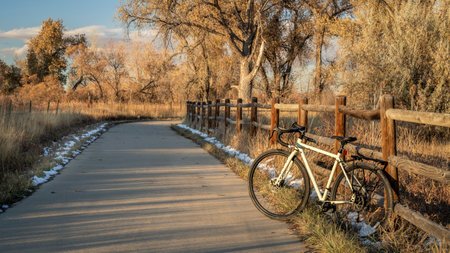 touring bike on a bike trail in late fall scenery - Poudre River Trail in northern Coloradoの写真素材