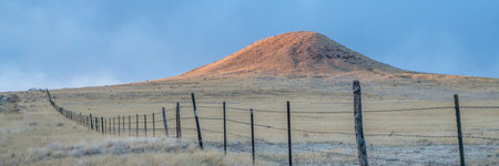 Cattle fence in Colorado prairie at sunset - Soapstone Prairie Natural Area near Fort Collinsの写真素材