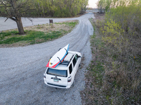 Dalton, MO, USA - April 23, 2023: Toyota 4Runner SUV with a performance stand up paddleboard...