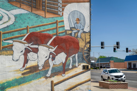 Chillicothe, MO, USA - April 23, 2023: The agricultural mural, coming into this country, on the city street.のeditorial素材