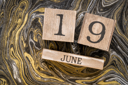 Juneteenth (June 19) in a desktop wooden calendar â also known as Freedom, Jubilee, Liberation, and Emancipation Day â is a holiday celebrating the emancipation of those who had been enslaved in the US.の写真素材