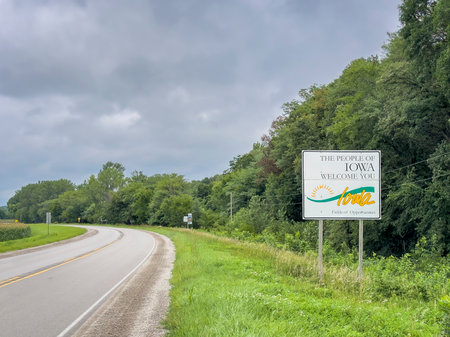 Iowa welcome roadside sign at state border with Nebraska, summer scenery, travel conceptの写真素材