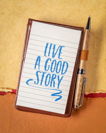live a good story - inspirational note or reminder in a small journalの写真素材