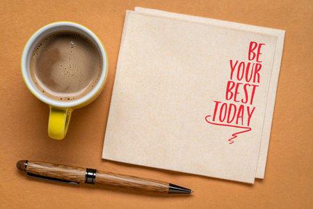 Be your best today - inspirational note on a napkin with coffee, mindset and personal development conceptの写真素材