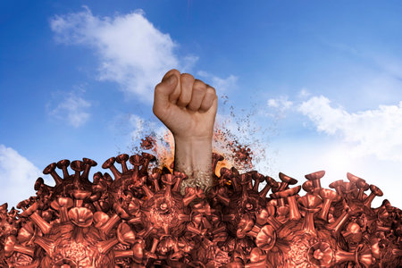 A fist hits a mountain of viruses from belowの写真素材