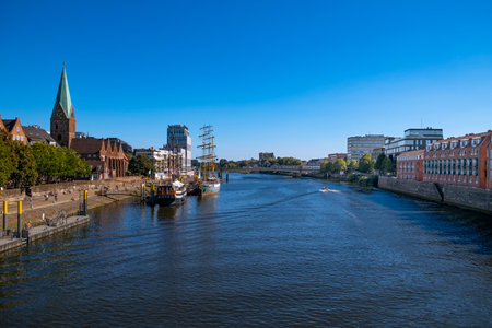 View over the Weser with sailing ships and the old townの写真素材