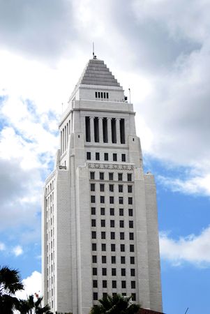 Skies are clearing up as sun shines down on city hall in Los Angeles, California.  の写真素材