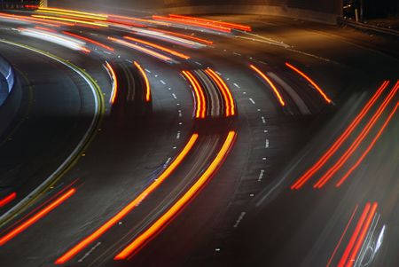 Vehicles streaking down the 101 Freeway at rush hour in Los Angeles, California.