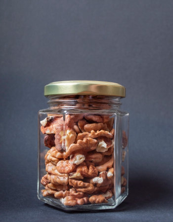 Walnuts in a glass jarの写真素材